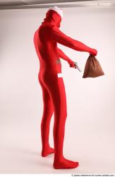 JOEL_ADAMSON CHRISTMAS VALLAIN WITH GUN AND BAG